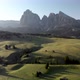 Aerial slider shot of Alpe di Suisi meadow  in the Dolomites mountains Italy - VideoHive Item for Sale