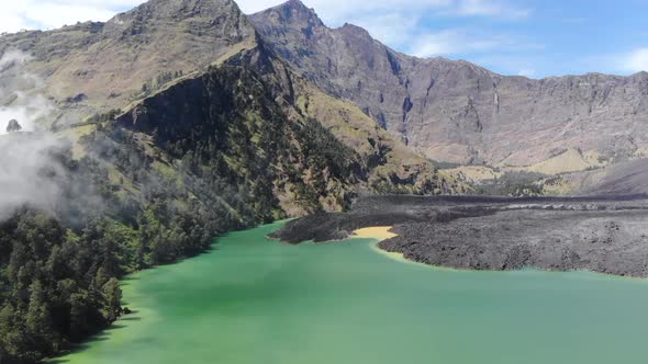 Aerial video of low laying clouds over Mount Rinjani in Indonesia (3) alt