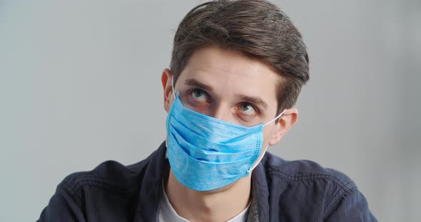 Closeup Masked Male Face Indoors Portrait Displeased Annoyed Tired Caucasian Millennial 30s Adult alt