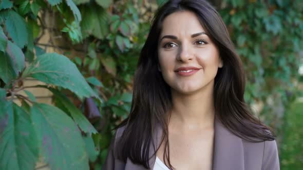 Beautiful Brunette Businesswoman In Business Clothes Walks alt