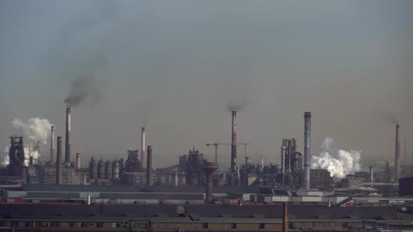 Air pollution from smoke emissions from industrial chimneys alt