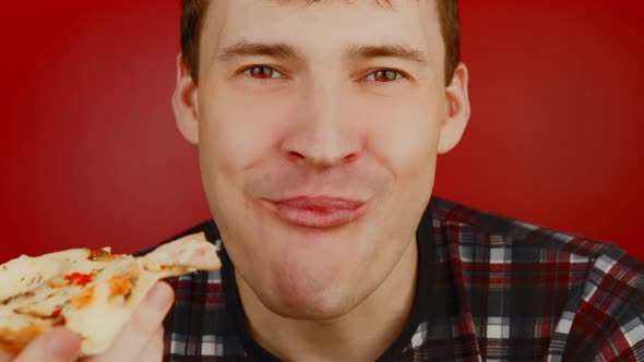 Young Man Eating Pizza alt