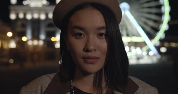 Close Up View of Charming Girl Turning Head and Looking To Camera. Young Female Person in Stylish alt