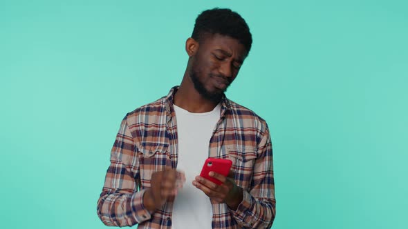 African American Man Use Mobile Phone Browsing Loses Sudden Lottery Results Bad Fortune Loss alt