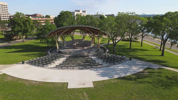 Drone view of park venue along Mississippi River in Wisconsin. Concert venue in park.