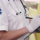 A Paramedic Writing On A Medical Chart Medical Stock Footage - VideoHive Item for Sale