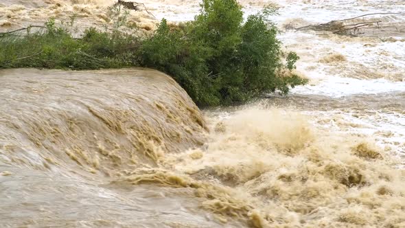 Dirty river with muddy water in flooding period during heavy rains in spring. alt