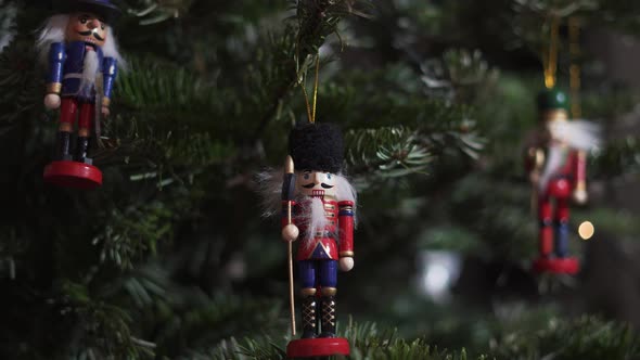 Decoration Toy Nutcracker on Christmas Tree. 4K Dolly Slider Shot. alt