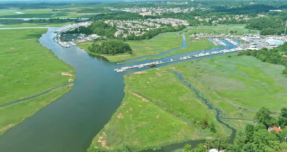 Aerial view boats in little port in ocean a little marina along the dockside alt