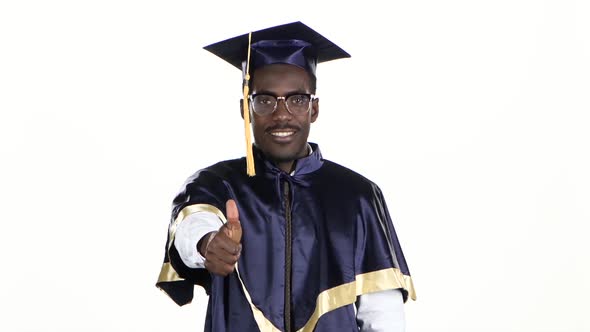 Black Man in Dressed for Graduation. White. Close Up alt
