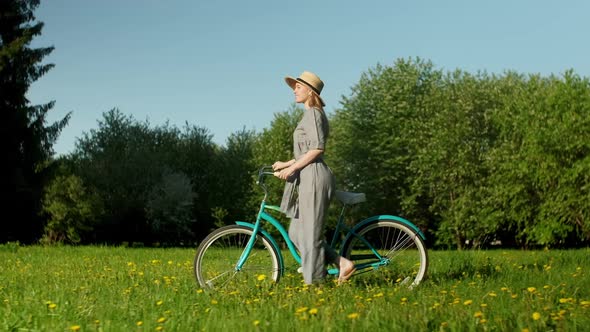 Cyclist Woman Walk With On Countryside Road At Summer Time alt