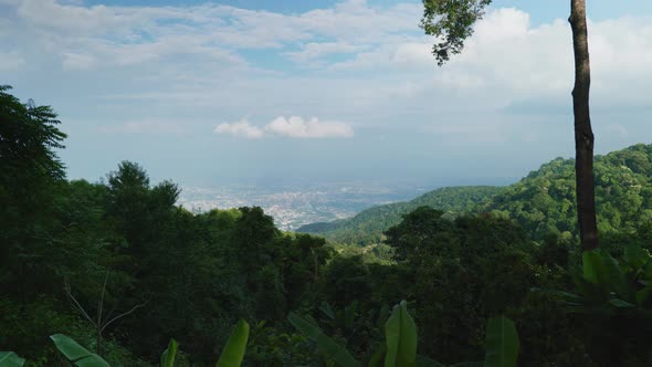 4K Cinematic landscape footage of the city of Chiang Mai, North Thailand from the top of Doi Pui on alt