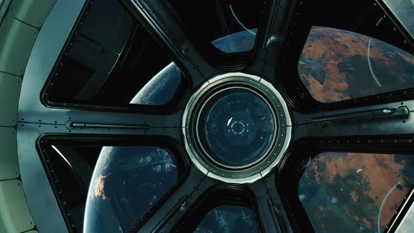 A View of the Earth Through the Big Quadrangle Porthole of a Space Station