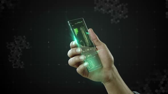 Hand holding futuristic mobile phone against digitally generated background alt
