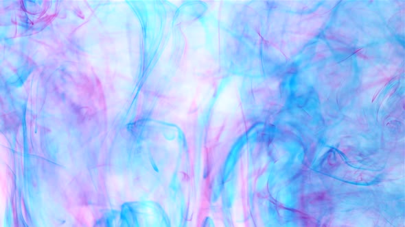 An abstract background of slow moving blue and pink dye ink under the water alt