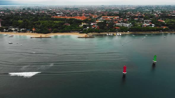 Beautiful cinematic Sanur beach, Bali drone footage with interesting landscape, fishing boats, hotel alt