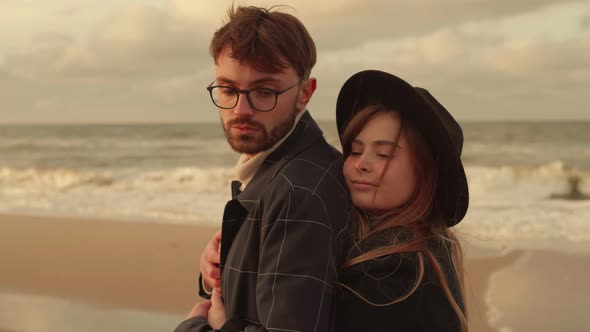 Young Couple Hugging on the Seashore alt
