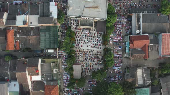 Aerial View of People offering prayers on the Eid morning at famous mosque Jama Masjid in Bekasi. alt
