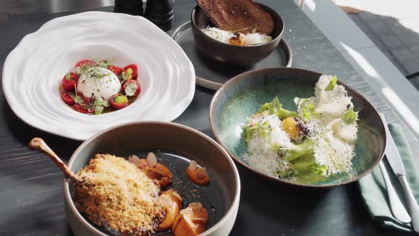 Set Table with Gourmet High Kitchen Dinner Plates and Dishes at the Restaurant alt