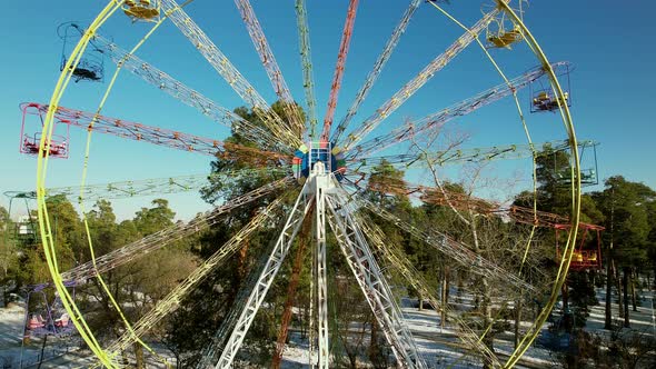 Old Multicolored Ferris Wheel in a Winter Park