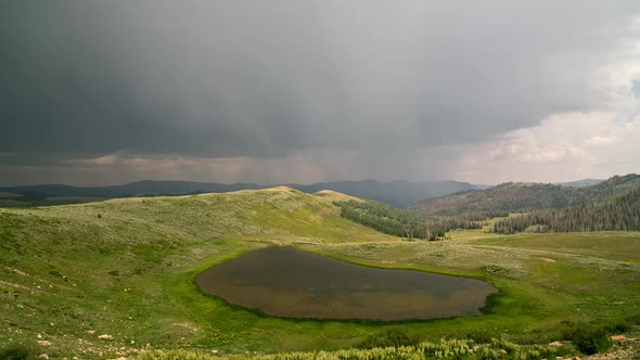 Timelapse of rain storm moving through the mountains alt