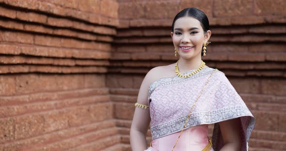 Portrait of Thai woman salute of respect in traditional costume of thailand alt