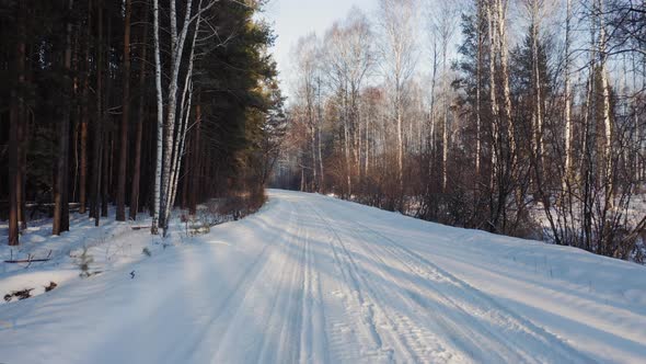 Driving on empty winter road, going backward