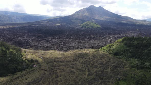 Aerial view of lava field from Mount Batur in Bali alt