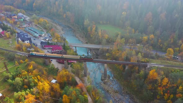 Aerial Drone Video Flying Over Railway Bridge in Carpathians Mountains, Yaremche, Ukraine alt