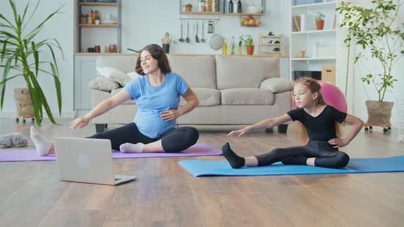 Pregnant Mother and Child Go in for Sports at Home Online