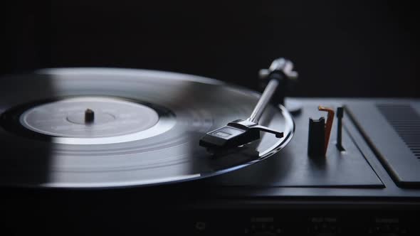 Music playing on retro vinyl gramophone. alt