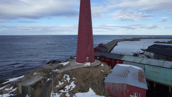 Aerial pedestal up shot of the Andenes Lighthouse Norway with people on top, stunning view of the ho alt