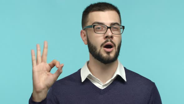 Close Up of Handsome Businessman in Glasses Showing OK Sign Say Okay and Nod in Approval Satisfied