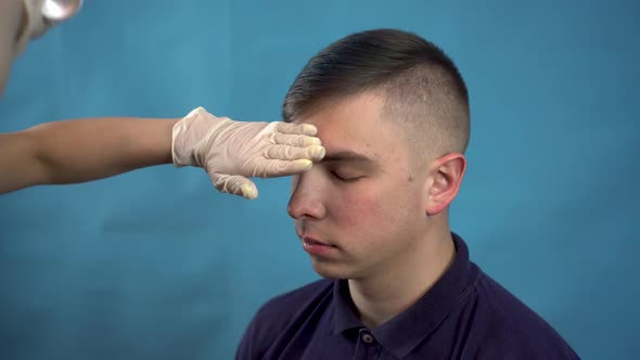 The Young Man Dyed His Hair Blue. An Alternative Person Is Dyed with Temporary Spray Hair Dye. On a alt