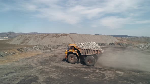 Multiton Overweight Dump Truck Brought Waste Rock for Unloading