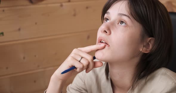 Thoughtful Young Woman Biting Her Lips Make Difficult Choice or Decision