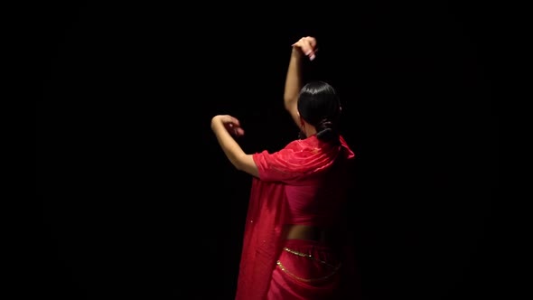 Woman Belly Dancer Arabian Dancing in Dark Studio at Black Background. Slow Motion alt