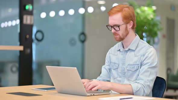 Loss, Casual Redhead Man Reacting To Failure on Laptop in Office  alt