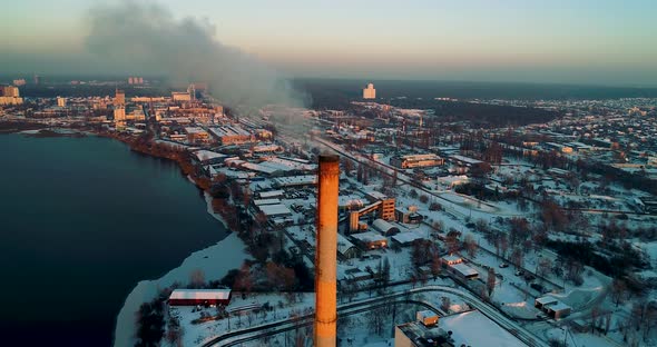 Garbage Incineration Plant in the City at Sunset alt