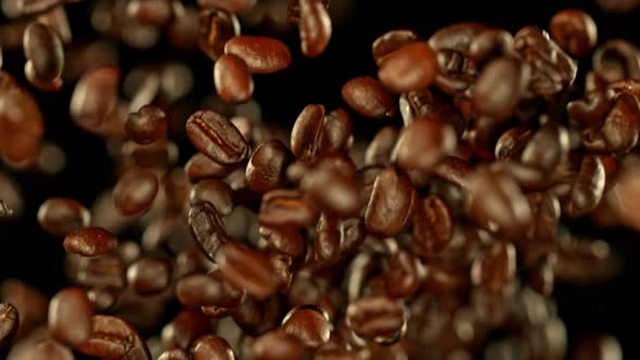 Super Slow Motion Shot of Exploding Premium Coffee Beans Towards the Camera at 1000Fps alt