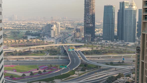 Aerial View of a Road Intersection in a Big City at Sunset Timelapse alt