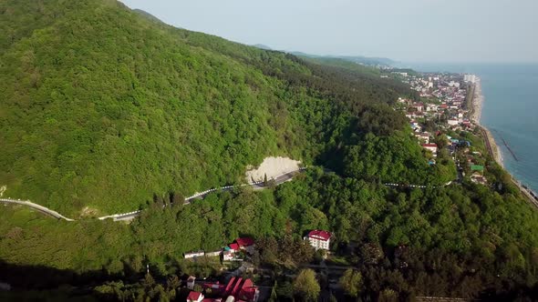 Cars Driving on Zig Zag Winding Road Near Sochi, South Russia alt