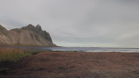 View From a Moving Car Window of a River and Mountains in Iceland alt