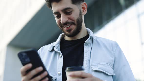 Elegant Bearded Man Using Social Media Application on Smartphone Text Messages Receive News