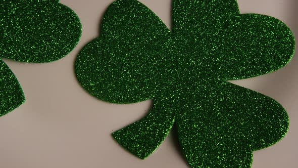 Rotating stock footage shot of St Patty's Day clovers on a white surface - ST PATTYS 003 alt