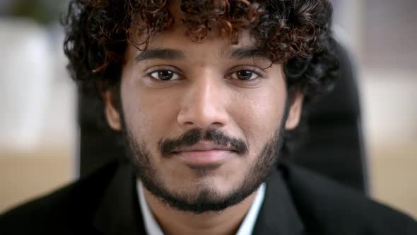 Confident Smiling Curlyhaired Indian Business Man Small Business Owner Company Leader or Sales alt