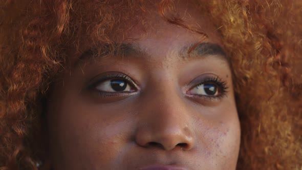 Close Up. Eyes of Young Black Woman Blinking in Slow Motion. Looking Down , Up, To the Sides and To alt