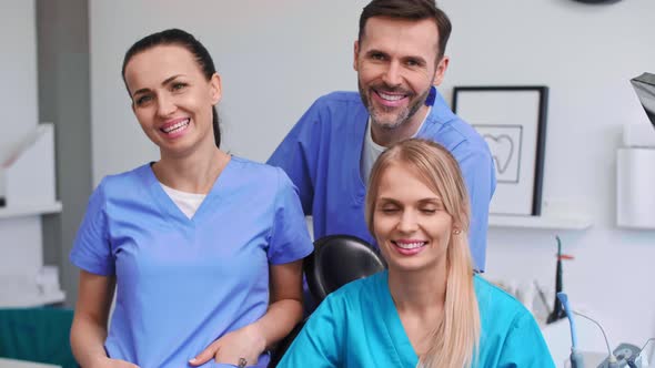 Portrait of three, smiling dentists in dentist's clinic alt