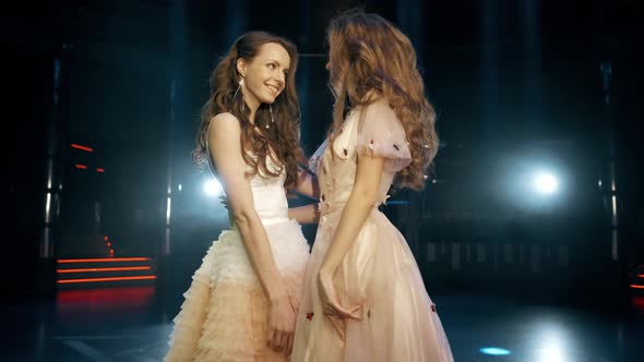 Sexy, Sensual and Seductive Woman Friends with Long Hair Posing in Dress at the Night Club. Slow alt