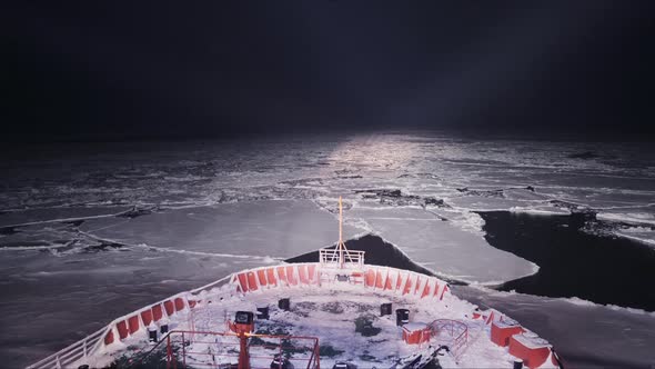 Timelapse of Icebreaker Ship Break Through Ice in the Night